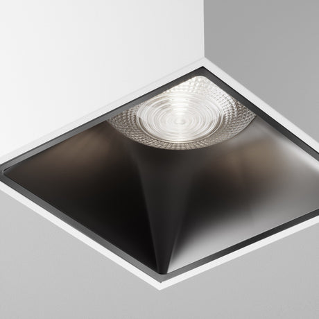 Close-up of Alfa LED Square Surface Downlight in white and black, emphasizing its elegant construction and high-end materials