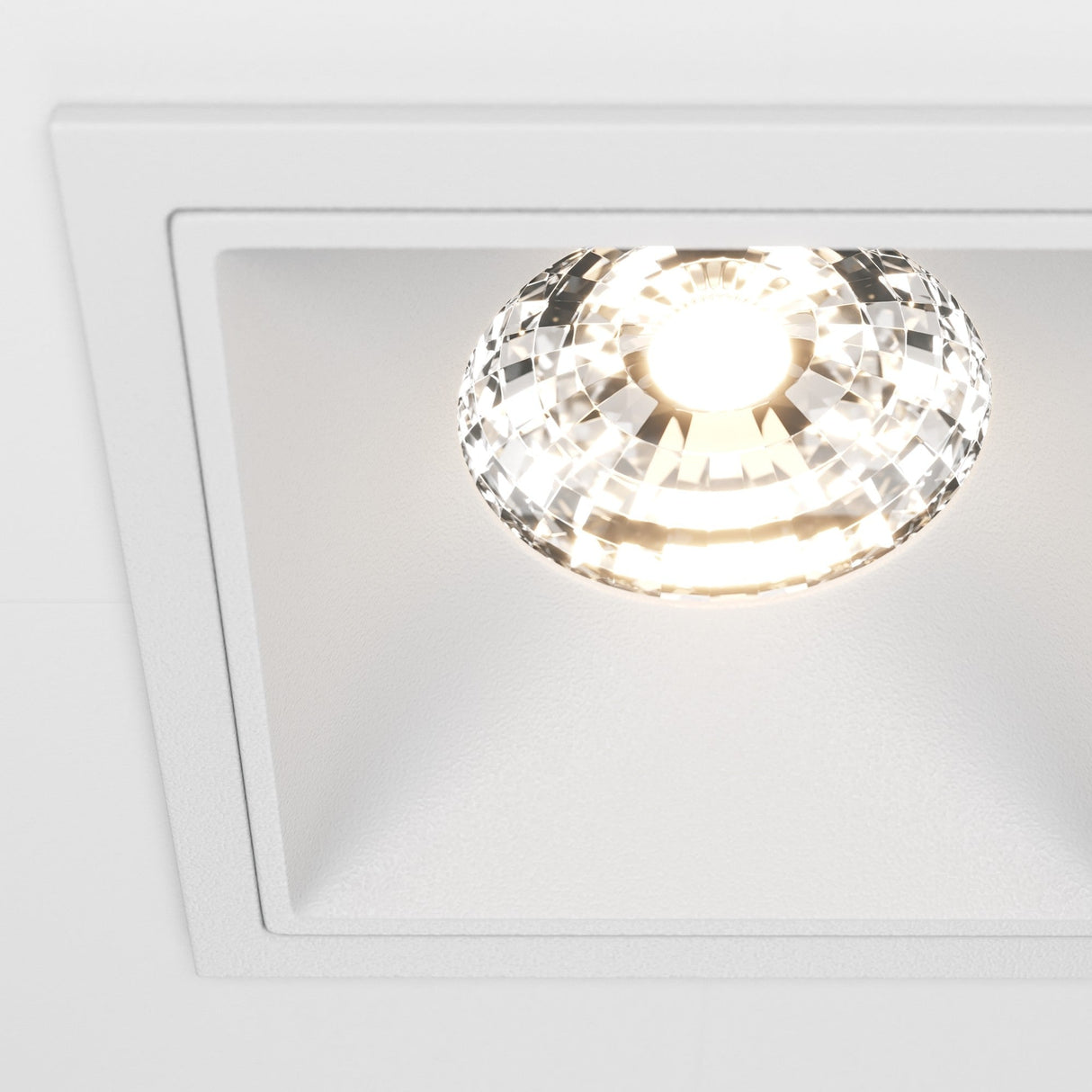 Detailed view of Alfa LED square recessed downlight in white, combining functionality with sleek design