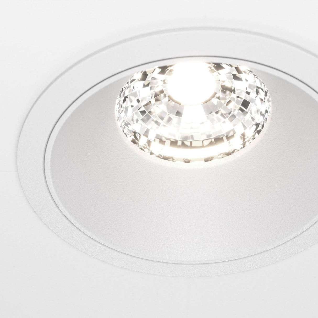 Close-up of the Alfa LED Dimmable Fixed Round Recessed Downlight in white, showcasing its sleek and modern design.