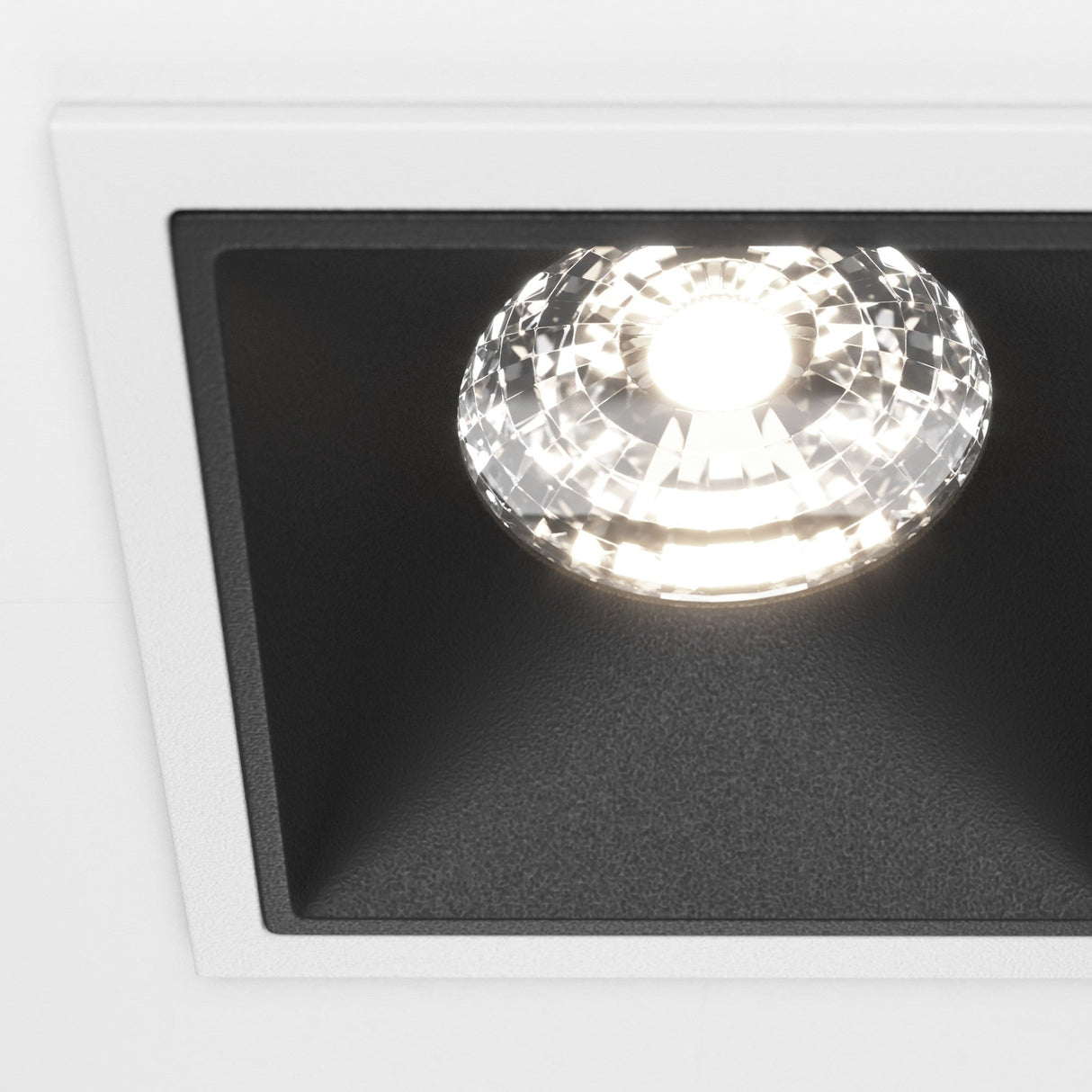 Close-up of the Alfa LED Dimmable Fixed Square Recessed Downlight in white and black, featuring a bold and contemporary design.