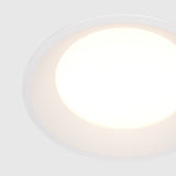 Element detail of Okno LED Round Recessed Downlight in White, emphasizing a subtle finish for modern ceiling integration.