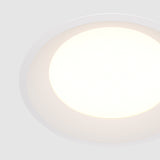Element detail of Okno LED Round Recessed Downlight in White, featuring a smooth design for seamless ceiling integration.