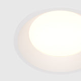 Close-up of Okno LED Round Recessed Downlight in white, detailing the smooth finish and understated aesthetic