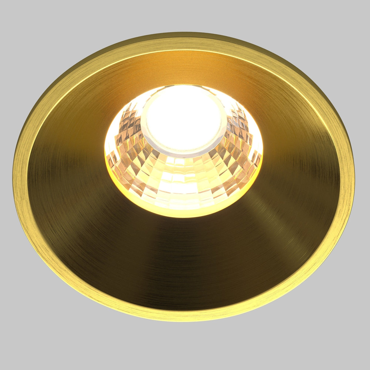 Close-up of round LED recessed downlight in brass, highlighting the quality craftsmanship and finish.
