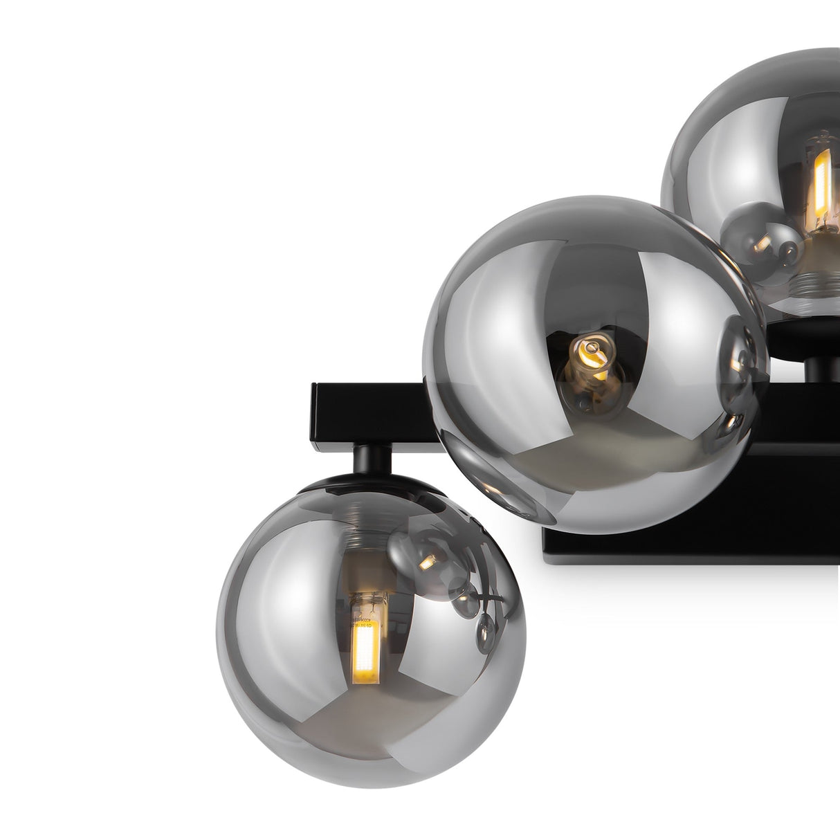 The Dallas 5 Light Wall Light features spherical smoked mirrored glass globes on a black frame, revealing glowing bulbs inside. This elegant and contemporary design is ideal for sophisticated interiors.