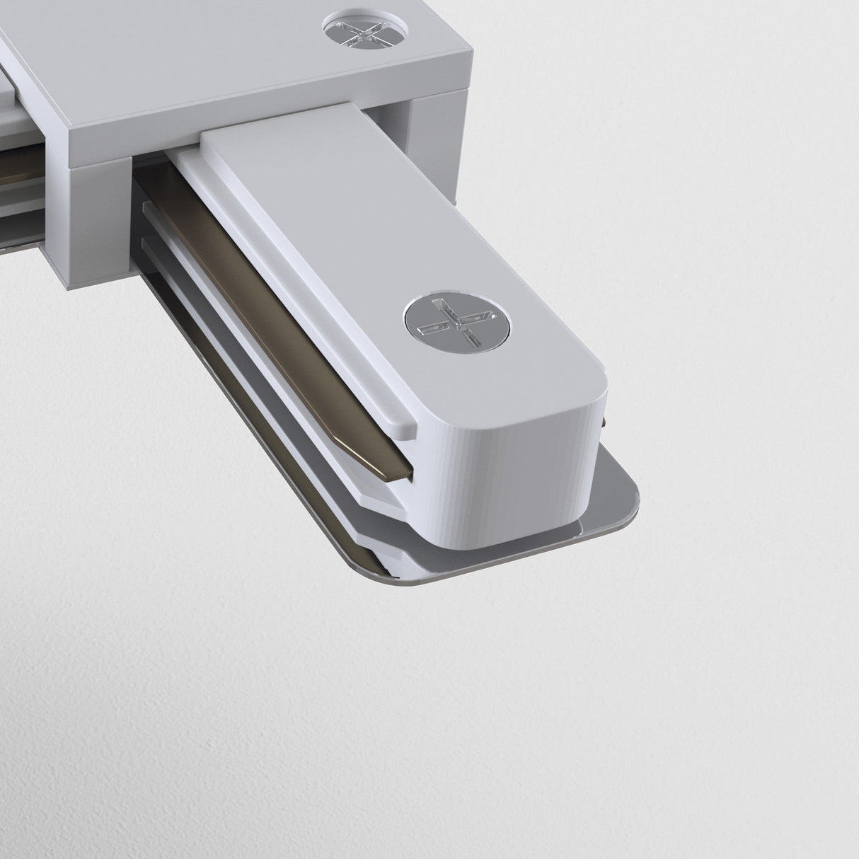 Close-up of a Unity Single Phase Surface-Mounted Track L-Connector in white against a white background. The sleek, minimalist design mirrors the elegance of modern track lighting, with its rectangular shape and circular logo imprint enhancing the overall finish.