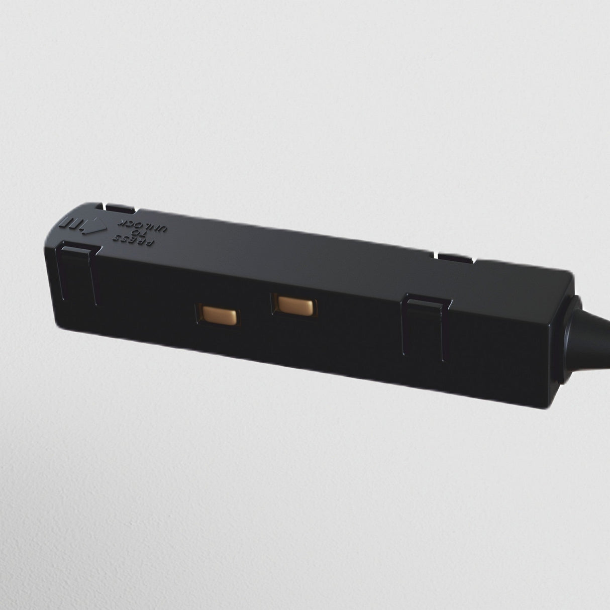 Close-up of the S35 Track Corner Power Connector - Black, featuring two rectangular sockets against a white background. Inscriptions adorn its surface, and a cable extends out of frame to the right.