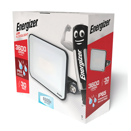 The packaging for the Energizer 30W LED Floodlight - 6,500K (Daylight) highlights its energy-efficient lighting features: delivering 3600 lumens with an IP65 water resistance rating. The box also includes an image of a smiling character alongside icons representing the product's outdoor performance and durability.