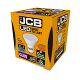 A 3D rendering of the JCB 4W GU10 Non-Dimmable LED Bulb packaging showcases its features, including cool daylight at 6500K. The box highlights a GU10 base, replaces a 35W bulb with 230 lumens output, and offers an impressive 91% energy savings with a lifespan of 10 years.