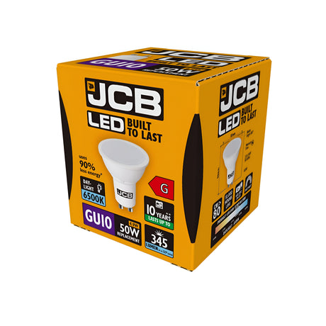 The image shows a JCB 4.9W GU10 Non-Dimmable LED Bulb packaged in a yellow box marked "Built to Last." Its key features include an energy-efficient GU10 base, acting as a 50W replacement, providing 345 lumens with a lifespan of 10 years, and delivering 90% energy savings. The packaging emphasizes its daylight color temperature of 6500K.