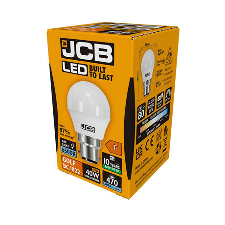 A pack of JCB 4.9W Non-Dimmable LED Golf Ball Bulbs features the "Built to Last" slogan. These energy-efficient bulbs offer a 40W equivalent with a brightness of 470 lumens and emit a daylight color temperature of 6500K. Rated F and equipped with a Bayonet Cap (B22), they boast a 10-year lifespan, showcased by an illustration on the side.