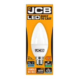 The packaging of the JCB 4.9W Non-Dimmable LED Candle Bulb - Daylight, B22, 6500K emphasizes its robust durability with a daylight glow at 6500K, offering brightness comparable to a 40W bulb and delivering 470 lumens. It provides up to 87% energy savings and boasts a lifespan of up to 10 years, making it an eco-friendly option that maintains high quality.