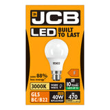 The packaging for the JCB 4.9W Non-Dimmable LED GLS Bulb features an image of a white bulb on an orange background. The text on the packaging emphasizes its key attributes: "Built to Last," using 88% less energy, emitting a 3000K warm white glow, being energy-efficient with a lifespan of 10 years, and having a GLS BC/B22 fitting. It serves as a 40W replacement by providing 470 lumens and holds an energy rating of F.