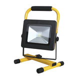 The PowerMaster 20W LED Rechargeable Worklight is a portable worklight with an energy-efficient SMD LED, featuring a black frame and yellow stand. It has a square shape with a reflective surface, adjustable base, rounded handle, and four black feet for stability.