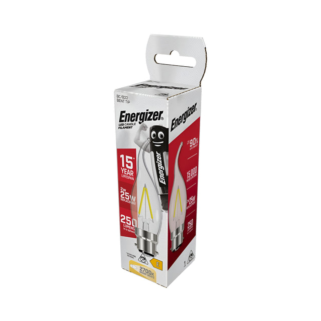 A package of Energizer 2W Non-Dimmable LED Candle Filament Bulbs, featuring a vintage-inspired bent tip design, boasts a 15-year lifespan and delivers 250 lumens of warm white light at 2700K. The primarily white packaging is accented with red and yellow, highlighting the energy-efficient qualities of these B22 bulbs.