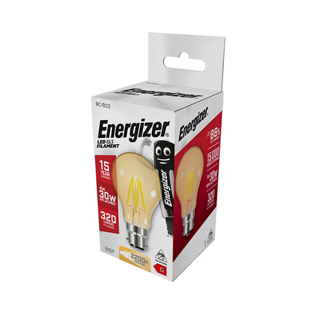 Image of an Energizer 4W Non-Dimmable LED GLS Gold Filament Bulb in its packaging, showcasing a warm white glow with gold-tinted glass. The box highlights its 2700K color temperature and equivalence to a 30W bulb at 320 lumens, boasting a lifespan of up to 15 years. A cartoon battery character decorates the side.