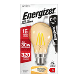 A box of Energizer 4W Non-Dimmable LED GLS Gold Filament Bulb in warm white, designed with gold-tinted glass and a vintage look. It offers an impressive lifespan of up to 15 years, acting as a 30W replacement with an output of 320 lumens. The bulb provides a cozy warm light at 2700K and features both a smiling character and a non-dimmable logo.