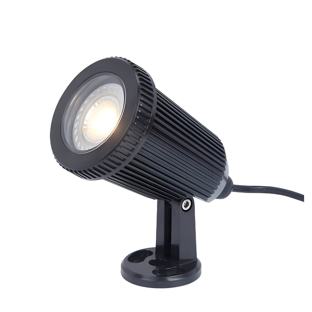 The Energizer Outdoor LED Spike Light in black, featuring a sleek cylindrical design and finned heat sink on a small stand, delivers a bright, focused beam and includes a power cord. It's perfect for highlighting landscape features and suitable for both indoor and outdoor lighting.