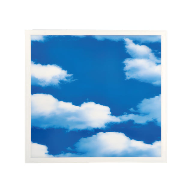 A white-framed picture displays a bright blue sky with fluffy white clouds, similar to the LumiLife 600x600 3D LED Cloud Panel (6000K, 40W) used in modern healthcare lighting to create a peaceful, sunny ambiance.