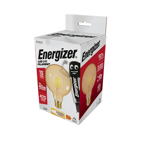 The packaging of the Energizer 5W G95 Dimmable LED Globe Gold Filament Bulb features a vintage design with specifications of 5W (equivalent to 40W), 470 lumens, and a warm white 2200K color temperature. It offers mood-enhancing dimmable functionality and boasts an impressive lifespan of up to 15 years with an energy rating of F. On the box, there is a cheerful cartoon battery character.