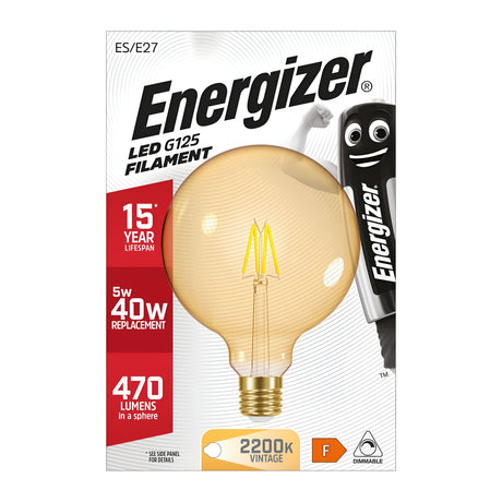 The packaging of the Energizer 5W G125 Dimmable LED Globe Gold Filament Bulb - Warm White, E27, 2200K highlights its impressive 15-year lifespan and energy-saving design, using just 5W instead of the traditional 40W. It delivers a cozy vintage glow with an output of 470 lumens at a warm color temperature of 2200K. The package features an image of the bulb alongside an iconic Energizer character.