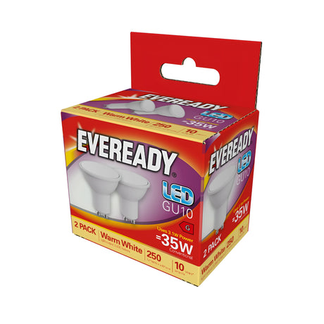 A box of energy-efficient Eveready 3.1W GU10 Non-Dimmable LED Bulbs, offering warm white light at 3000K, comes in red and white packaging featuring a 2 Pack. Images of the bulbs are prominently displayed on the box.