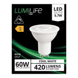 The image shows the packaging for a LumiLife 5.7W GU10 Dimmable LED Bulb in Cool White (4000K), emphasizing its role as an energy-efficient 60W replacement with 420 lumens. The black box with green accents highlights its energy-efficient features and carries an energy efficiency rating of E.