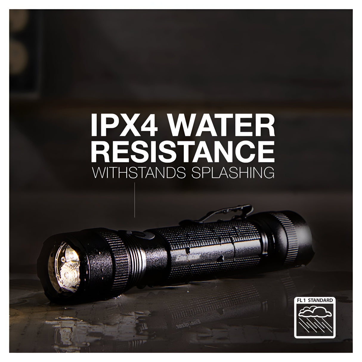 A black Energizer Rechargeable LED Torch 700 Lumen with a textured grip rests on a wet surface. Text above reads IPX4 Water Resistance Withstands Splashing, and a symbol indicates compliance with the FL1 Standard, making it an essential tool for emergency preparedness.