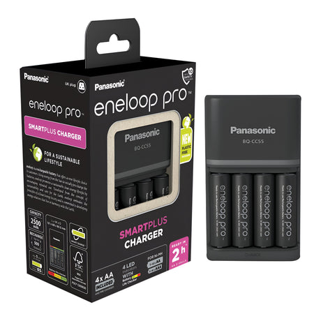 Photograph of a Panasonic Eneloop Pro Battery Charger with four AA 2500mAh rechargeable batteries. The packaging emphasizes Smart Charge technology and shows the charger next to the box, loaded with the included batteries. This version comes with a UK plug.