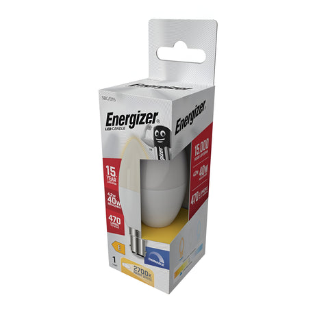 The packaging of the Energizer 4.2W Dimmable LED Candle Bulb, Warm White, B15 emphasizes its remarkable energy efficiency, boasting a 15,000-hour lifespan and a cozy 2700K glow. It delivers 470 lumens to effectively replace a traditional 40W bulb and features a cheerful stylized battery character on the package.
