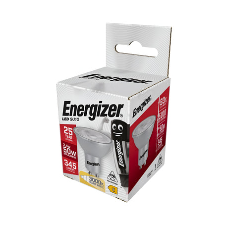 The Energizer 3.4W GU10 Non-Dimmable LED Bulb's packaging emphasizes its remarkable 25-year lifespan and outstanding energy efficiency, consuming just 3.4 watts yet delivering the equivalent of 50 watts. It produces 345 lumens of inviting warm white light at 3000K, with the box showcasing an illustration of the bulb alongside a character proudly holding it.