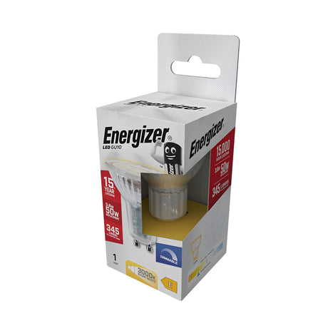 The image displays a package of the Energizer 3.6W GU10 Dimmable LED Bulb in Clear Warm White at 3000K, offering an energy-efficient lighting solution with a lifespan of 15 years. It produces 345 lumens of light, equating to a traditional 50-watt bulb. The LED bulb is housed in a predominantly white box accented in red, featuring the smiling battery mascot.