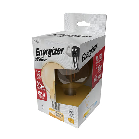 The Energizer 5W G95 Non-Dimmable LED Globe Gold Filament Bulb, which operates at 2200K and provides warm white light, offers a remarkable lifespan of 15,000 hours with a brightness of 550 lumens. It features energy-efficient packaging in white accented with red and yellow, showcasing detailed product information and branding.