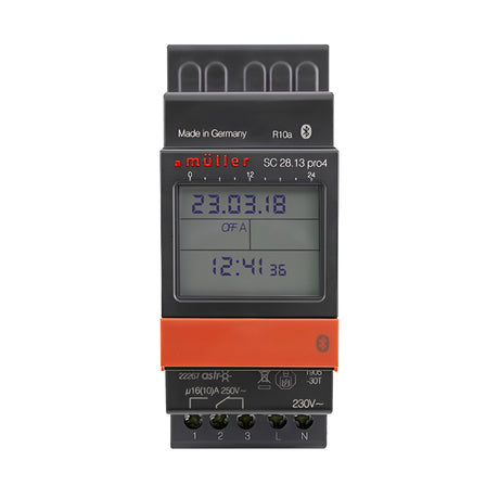 The Astro Bluetooth 2 Module 1 Channel 7 Day Time Switch, with its sleek grey and orange design, boasts a screen displaying 23.03.18 and 12:41 in crisp black digits. Text reads "Made in Germany" and "müller." With multiple buttons and connection ports, it supports versatile switching capacity.