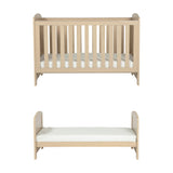 Seeker Convertible Cot Bed in Nordic light oak effect finish, shown as a slatted cot with mattress above and as a low toddler bed below, on a plain white background.