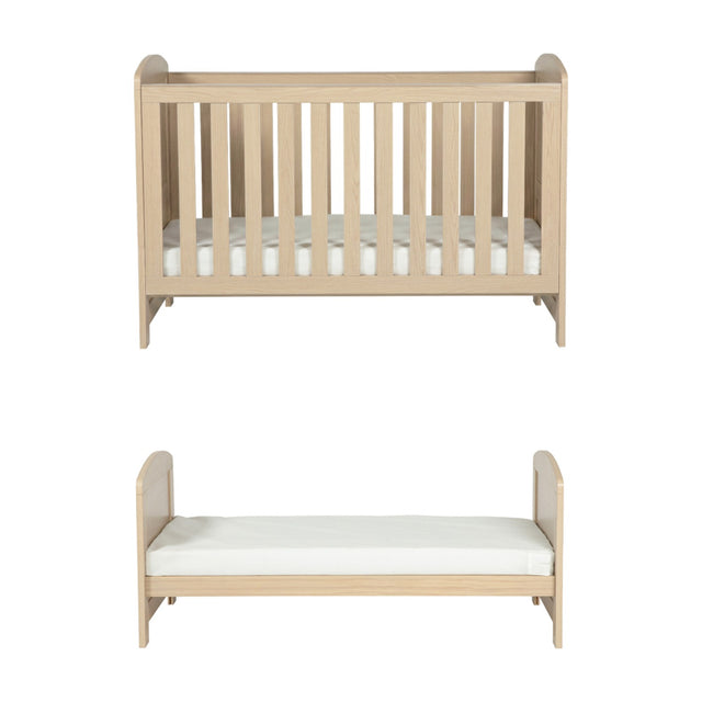 Seeker Convertible Cot Bed in Nordic light oak effect finish, shown as a slatted cot with mattress above and as a low toddler bed below, on a plain white background.