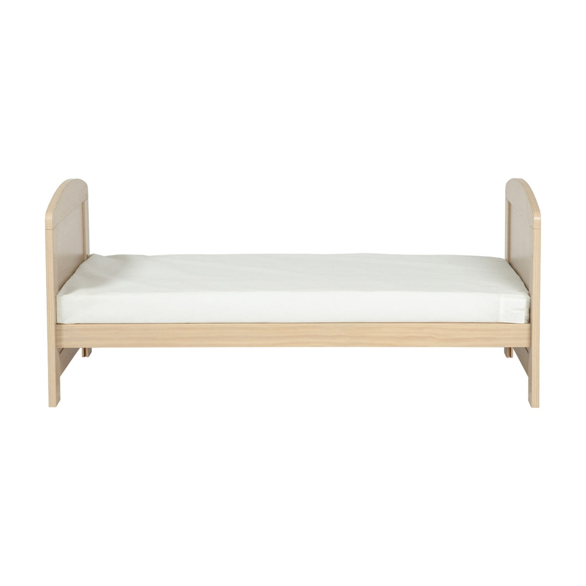 Seeker Convertible Cot Bed & 3 Position Base in Nordic, shown as a toddler bed with curved solid end panels in a light oak effect finish and white mattress, on a plain white background.