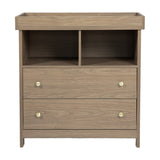 Seeker Changing Table with Drawers in Drift, a wood-finish MDF unit with raised tray top, two open compartments, two drawers with brass-tone knobs, and tapered legs.