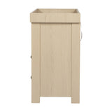 Seeker Changing Table in Nordic, side view showing raised tray top, panelled wood-finish side, and metal handle detail against a plain white background.