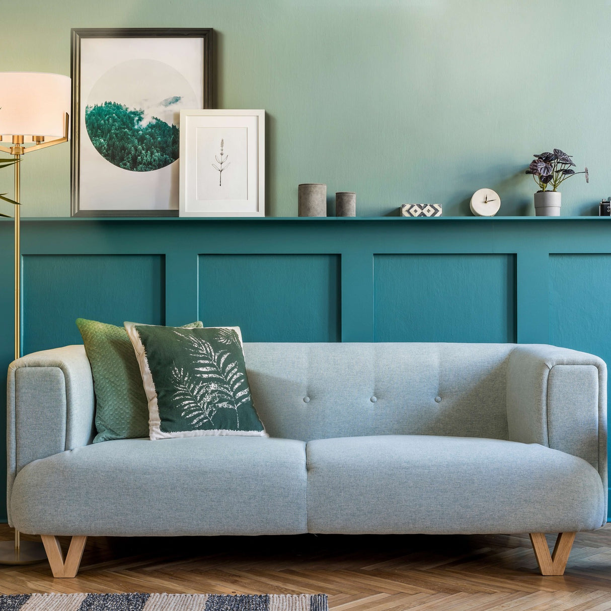 Clifton 3 light floor lamp in brass finish, shown in a room setting