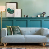 Clifton 3 light floor lamp in brass finish, shown in a room setting