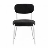 Smith Dining Chair with black velvet seat and curved backrest, set on slim silver metal legs, shown against a plain white background.