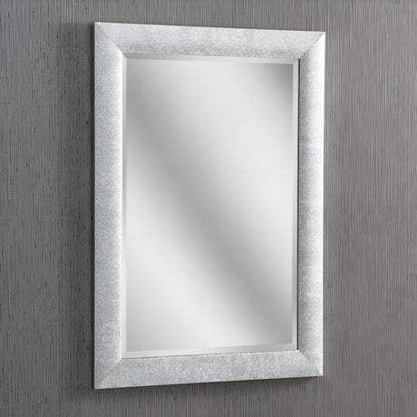 The Stardust Rectangle Wall Mirror - Silver, with its textured silver frame, adorns a vertically striped gray wall, exuding modern elegance. Its reflective surface displays no objects, creating a clean and minimalist aesthetic.
