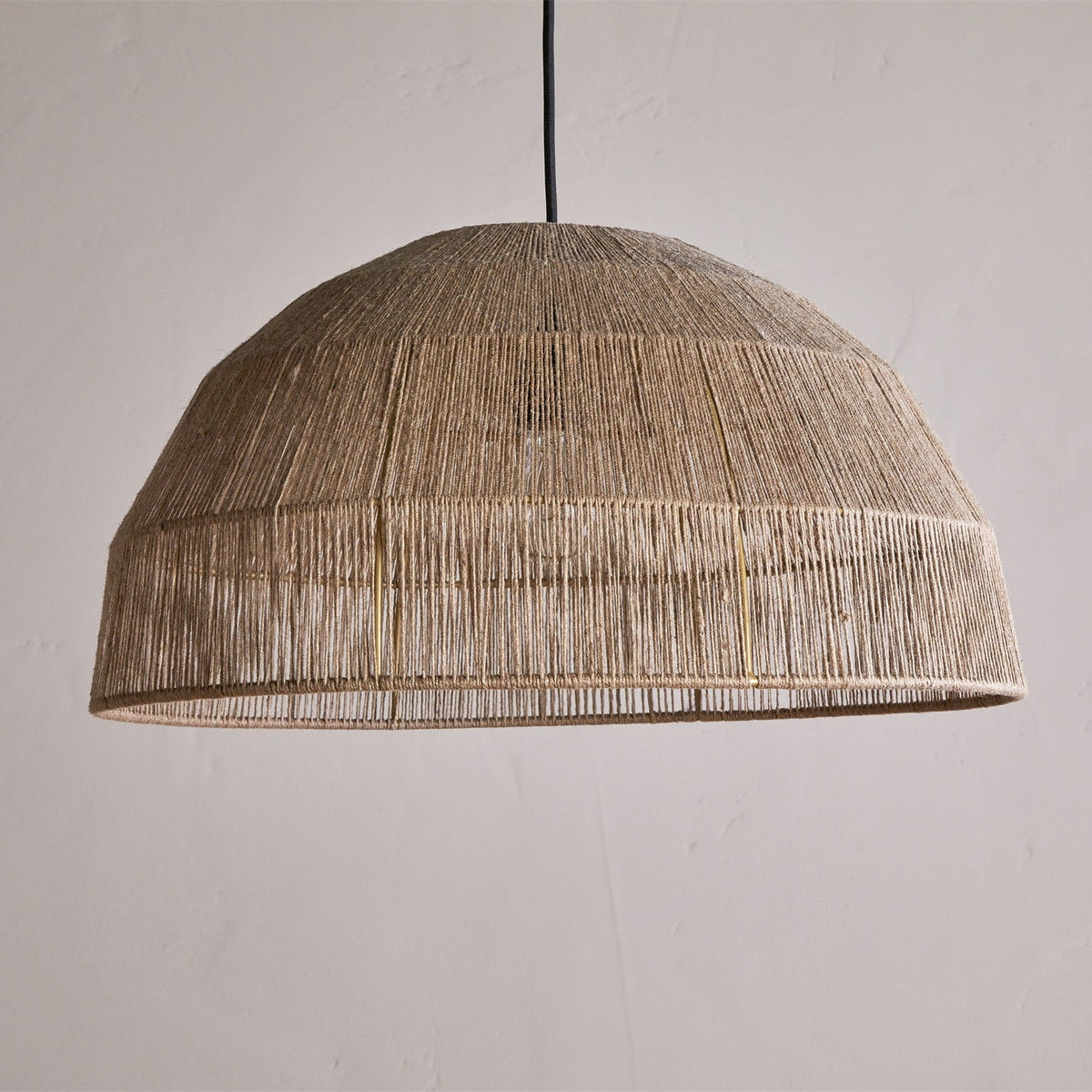 Tivi Natural Jute Lampshade – wide dome pendant shade wound in fine vertical jute cord with horizontal binding bands, shown on a plain light background with black cable.