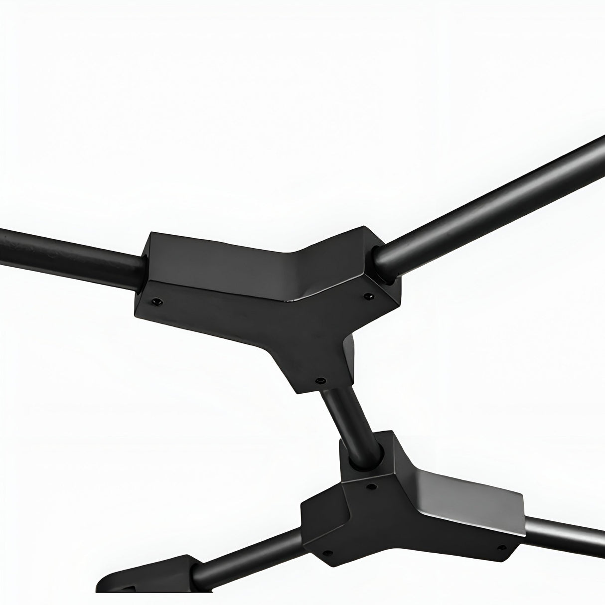 Close-up of two black, angular metal joints connected by cylindrical rods on a white background, showcasing the modern elegance of the Tree 5 Light Suspension - Black fixture.