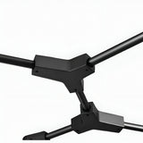 Close-up of two black, angular metal joints connected by cylindrical rods on a white background, showcasing the modern elegance of the Tree 5 Light Suspension - Black fixture.