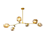 The Tree 6 Light Suspension - Gold features a striking branching design with six exposed bulbs in round glass shades and a gold metal frame, making it a luxurious chandelier ideal for modern interiors.