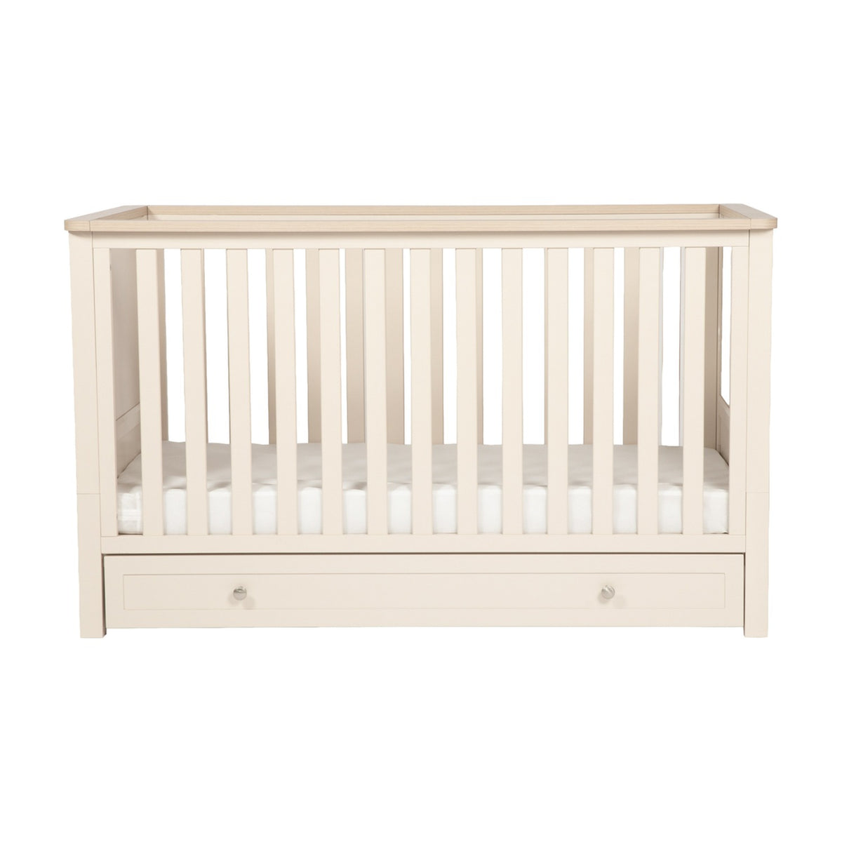 Wanderer Convertible Cot Bed with Drawer in Cashmere, slatted sides with oak-effect top rail, under-bed storage drawer with knob handles, shown on a plain white background.