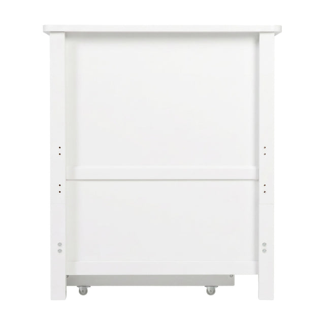 Wanderer Convertible Cot Bed with Drawer in white, rear view showing solid MDF panel, side posts, height adjustment holes, and castors, on a plain background.
