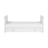 Wanderer Convertible Cot Bed with Drawer in white MDF, shown as a day bed with raised end panels, white mattress, and an under-bed storage drawer with two round knobs, on a plain background.